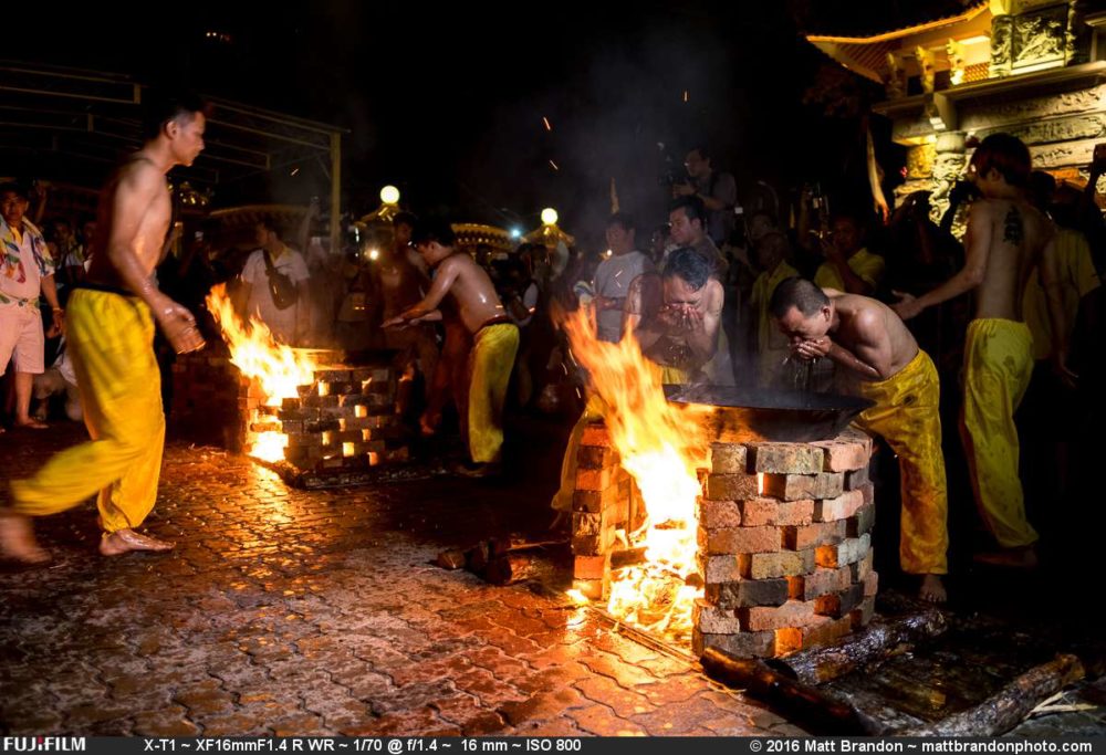 The medium reached into the hot oil with their hands and then scooped it into their mouths.