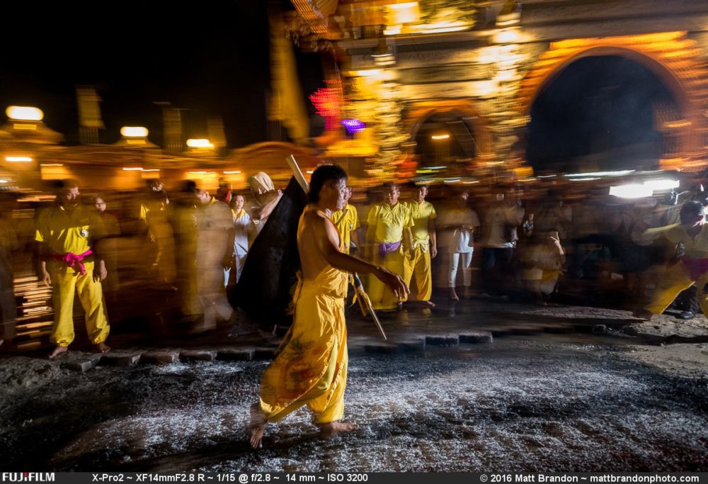 One of the mediums casually walking across the coals.