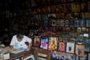 A Chiang Mai shop keeper reads his morning paper.