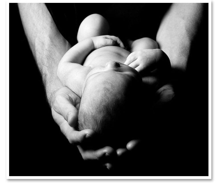 A new born and some dramatic light.