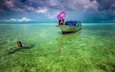 The Bajau look down at the fish.